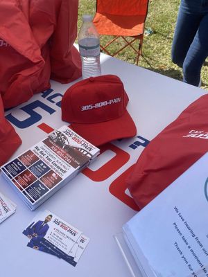 305-800-PAIN branded hat and marketing materials